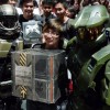 Student Justin Lau, 16, stands proud with Master Chief as he receives his Halo: Reach Legendary Edition